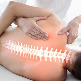 Digital composite of Highlighted bones of man at physiotherapy